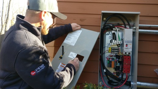 Tech looking in an electrical box